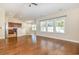 Open-concept living room with hardwood floors and a view of the kitchen and dining area at 2960 Tigers Eye Rd., Little River, SC 29566