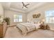 Inviting main bedroom with decorative accents, ceiling fan and lots of light at 2960 Tigers Eye Rd., Little River, SC 29566