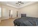 Spacious main bedroom with tray ceiling, and carpet flooring at 2960 Tigers Eye Rd., Little River, SC 29566