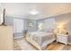Cozy bedroom featuring a white wooden bed frame and matching nightstands on vinyl floor, with a light blue accent wall at 308 24Th Ave. N, North Myrtle Beach, SC 29582