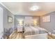 Cozy bedroom featuring a white wooden bed frame and matching nightstands on vinyl floor, with a light blue accent wall at 308 24Th Ave. N, North Myrtle Beach, SC 29582