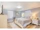 Inviting bedroom with neutral tones, featuring wood-look floors, soft lighting, and a comfortable bed at 308 24Th Ave. N, North Myrtle Beach, SC 29582