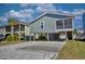 Coastal home featuring covered parking, elevated construction and a charming, screened porch area at 308 24Th Ave. N, North Myrtle Beach, SC 29582