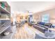 Inviting living room featuring a comfortable leather couch, stylish decor, open floor plan, and plenty of natural light at 308 24Th Ave. N, North Myrtle Beach, SC 29582