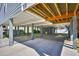 Well-maintained underneath of house with carport and additional storage space at 308 24Th Ave. N, North Myrtle Beach, SC 29582
