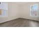 Cozy bedroom featuring hardwood floors, natural light, and neutral paint at 319 Crossing Ct., Myrtle Beach, SC 29588