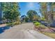 Gated entrance to the Harbor Oaks Marina neighborhood with mature landscaping at 319 Crossing Ct., Myrtle Beach, SC 29588