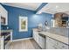 Kitchenette with modern appliances, stone backsplash, granite countertops, and water views at 319 Crossing Ct., Myrtle Beach, SC 29588