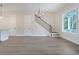 Open living room area with hardwood floors and staircase at 319 Crossing Ct., Myrtle Beach, SC 29588