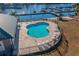 Community pool overlooking the marina with sundeck and lounge chairs at 319 Crossing Ct., Myrtle Beach, SC 29588