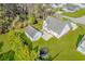 Aerial view of a home with a detached garage, a large yard, patio area, and trampoline at 359 Rose Ave., Georgetown, SC 29440