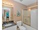 Neutral bathroom featuring granite countertops, framed mirror and a shower/tub combination with sliding door at 359 Rose Ave., Georgetown, SC 29440