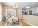 Bright dining area featuring a window view and open access to the kitchen at 359 Rose Ave., Georgetown, SC 29440