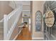 Welcoming entryway featuring hardwood floors, a staircase, decor, and a view into the living room at 359 Rose Ave., Georgetown, SC 29440