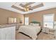 Spacious bedroom featuring tray ceiling, neutral tones, and ample natural light at 359 Rose Ave., Georgetown, SC 29440