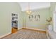 Playroom with chandelier, posters, and peek-a-boo into kitchen with stainless steel appliances at 359 Rose Ave., Georgetown, SC 29440