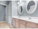 Well-lit bathroom with double sinks and a linen closet at 1501 Hallborough Dr., Surfside Beach, SC 29575