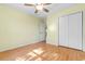 Bedroom with hardwood floors, ceiling fan and closet features access to the rest of the home at 1501 Hallborough Dr., Surfside Beach, SC 29575