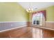 Charming dining room featuring hardwood floors, a chandelier, and natural light at 1501 Hallborough Dr., Surfside Beach, SC 29575