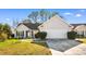 Inviting home exterior with a two-car garage and well-kept landscaping, set in a serene neighborhood at 1501 Hallborough Dr., Surfside Beach, SC 29575