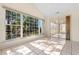 Sun room featuring tile floors, multiple windows with views and a sliding glass door at 1501 Hallborough Dr., Surfside Beach, SC 29575