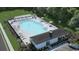 Community pool with lounge chairs, pergolas, and a nearby recreational building at 371 Myrtle Meadows Dr # 417B, Conway, SC 29526