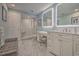 Contemporary bathroom featuring a walk-in shower, marble floors, and double vanity at 377 Waties Dr., Murrells Inlet, SC 29576