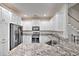 Modern kitchen featuring white cabinetry, stainless steel appliances, and granite countertops at 377 Waties Dr., Murrells Inlet, SC 29576