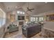 Inviting living room with vaulted ceiling, fireplace, and an open layout leading to the dining area at 377 Waties Dr., Murrells Inlet, SC 29576