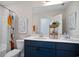 Bathroom with a double sink vanity, colorful shower curtain and modern decor at 4019 Bucolic Loop, Myrtle Beach, SC 29588