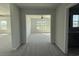 View from the hallway into the bedroom, with plush carpeting and a ceiling fan at 4019 Bucolic Loop, Myrtle Beach, SC 29588