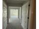View from the hallway into the bedroom, with plush carpeting and a ceiling fan at 4019 Bucolic Loop, Myrtle Beach, SC 29588