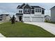 Beautiful two-story home featuring a spacious three-car garage and manicured lawn at 4019 Bucolic Loop, Myrtle Beach, SC 29588