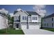 Charming new construction home featuring a two-car garage and gray siding at 4019 Bucolic Loop, Myrtle Beach, SC 29588