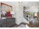 Elegant foyer with staircase, designer decor, and hardwood floors at 4019 Bucolic Loop, Myrtle Beach, SC 29588