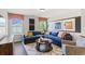 Comfortable living room with a sectional sofa, patterned rug, and bright natural light from nearby windows at 4019 Bucolic Loop, Myrtle Beach, SC 29588