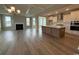 Open floor plan featuring a spacious living room, modern kitchen, and stunning hardwood floors at 4019 Bucolic Loop, Myrtle Beach, SC 29588