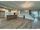 Open floor plan featuring a spacious living room, modern kitchen, and stunning hardwood floors at 4019 Bucolic Loop, Myrtle Beach, SC 29588