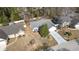 A high-angle view of the home with mature landscaping, a paved driveway, and a two-car garage at 4030 Manor Wood Dr., Myrtle Beach, SC 29588