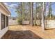 A shot of the backyard space showing the privacy fence and mature trees at 4030 Manor Wood Dr., Myrtle Beach, SC 29588