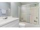 Bathroom with a white vanity, toilet, and sliding glass shower doors at 4030 Manor Wood Dr., Myrtle Beach, SC 29588