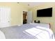 Bright bedroom with a wall mounted television and doorway at 4030 Manor Wood Dr., Myrtle Beach, SC 29588