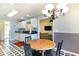 Cozy breakfast nook with a view of the living room, featuring a modern chandelier at 4030 Manor Wood Dr., Myrtle Beach, SC 29588