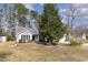 Charming single-story home with mature trees and a well-manicured lawn at 4030 Manor Wood Dr., Myrtle Beach, SC 29588