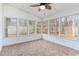 Sunroom with white paneled walls and multi-paned windows at 4030 Manor Wood Dr., Myrtle Beach, SC 29588