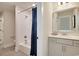 Well-lit bathroom featuring a shower over tub with subway tile, a neutral vanity, and a framed mirror at 4060 Bucolic Loop, Myrtle Beach, SC 29588