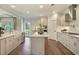 Spacious kitchen with an island, custom cabinets, stainless steel appliances and hardwood flooring at 4060 Bucolic Loop, Myrtle Beach, SC 29588