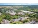 An expansive aerial view of a large campus featuring lush greenery and stately brick buildings at 418 Clear Lake Dr., Conway, SC 29526