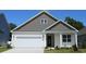 Charming one-story home featuring a white garage, craftsman style door, and gray shingle accents at 418 Clear Lake Dr., Conway, SC 29526