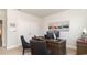 Bright home office featuring neutral walls, plush carpet, and a stylish dark wood desk and chairs at 418 Clear Lake Dr., Conway, SC 29526